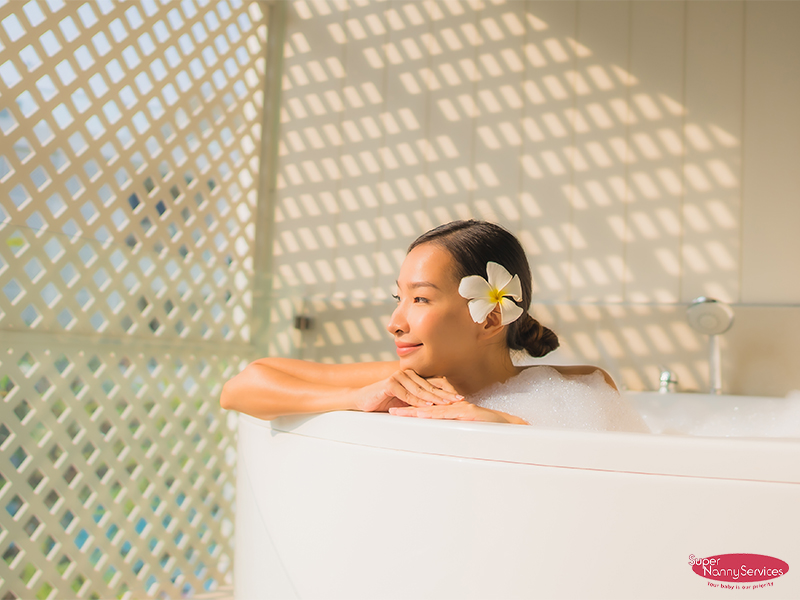 New Mom getting pampered in a herbal bath