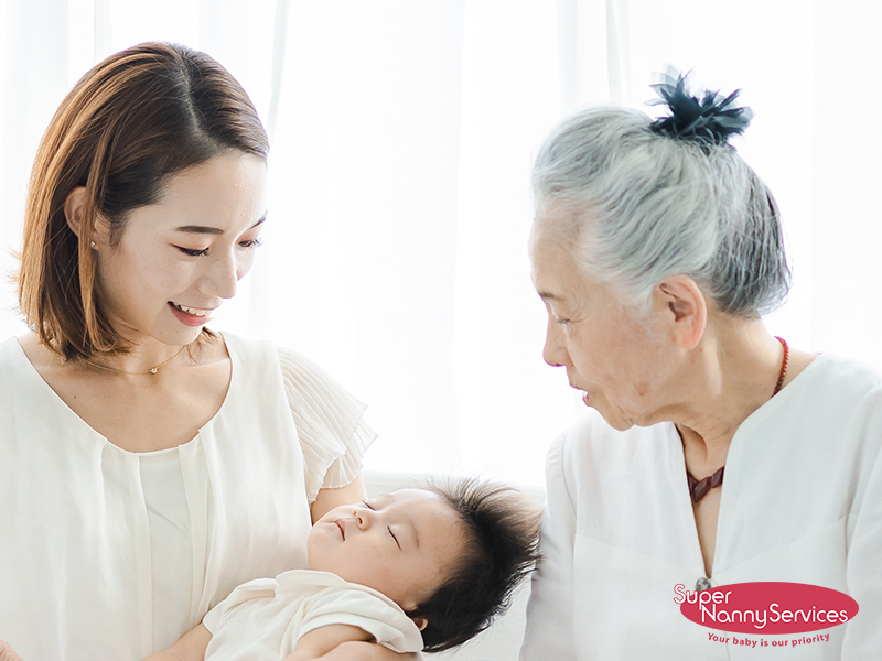 Confinement Nanny Assisting a Mother With Her Baby