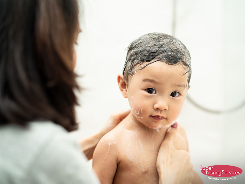 confinement nanny bathing a baby