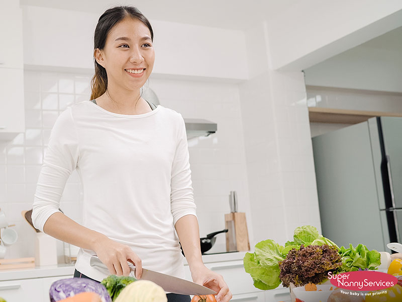 confinement nanny preparing home cooked meals