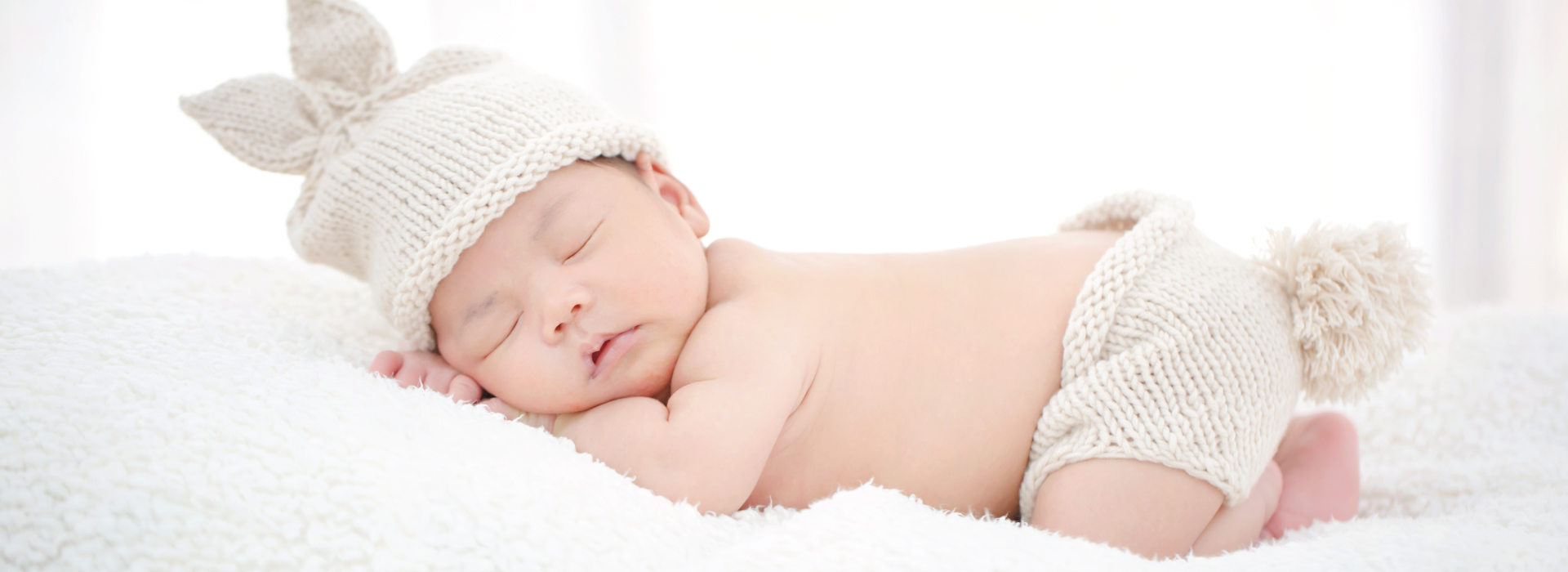 Adorable baby with a hat and knitted hat