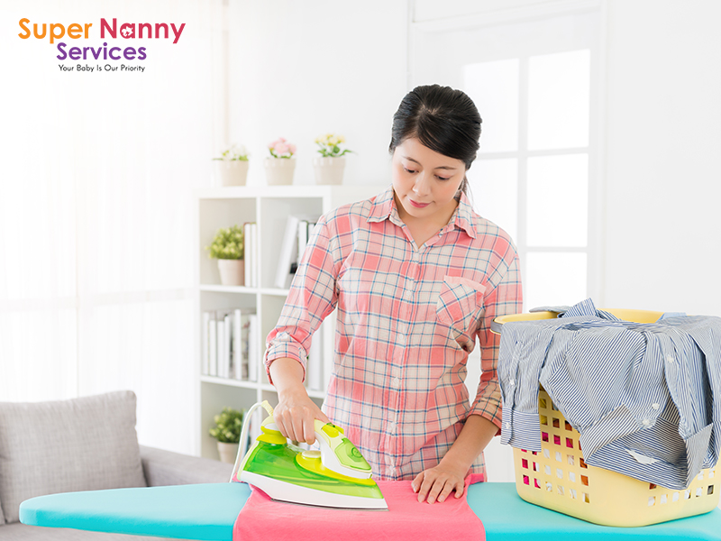 Image of nanny ironing clothes