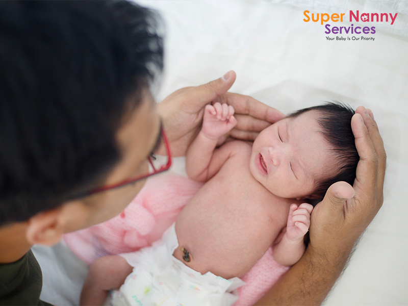 Father bonding with his newborn baby.