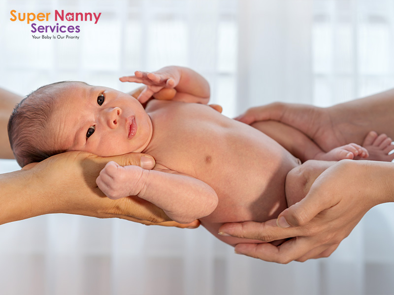 Parents lovingly holding their newborn baby.